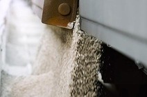 Unloading of building materials from a freight wagon.