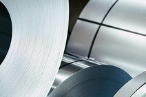 Steel – close-up of rolled steel coils ready for transport.