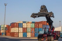 Reach stacker lifting container at BILK Terminal Budapest.