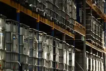 Warehouse Sarajevo with stacked IBC containers on high shelves