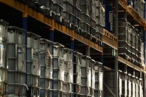 Warehouse Sarajevo with stacked IBC containers on high shelves