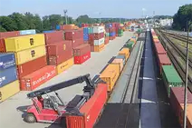 Rail Cargo Terminal Mělník with container handling vehicle and stacked containers