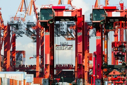 Container terminal with cranes handling containers in freight transport