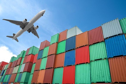 Airplane above containers symbolising air freight transport