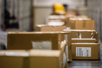 Cartons on conveyor belt symbolising groupage freight transport