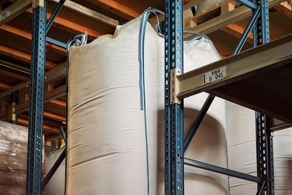 Large bulk bags stored on high-bay warehouse shelving
