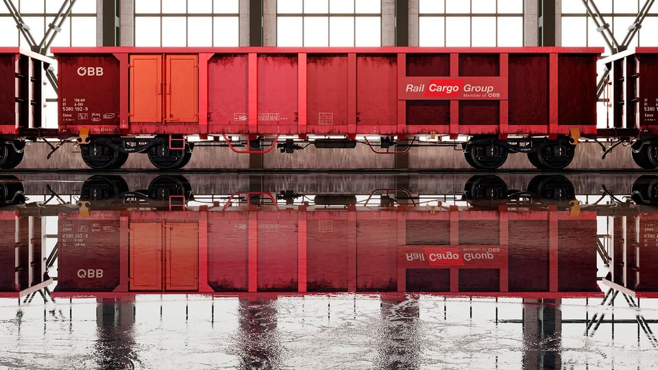 Rendering eines Rail Cargo Group Güterwagen in einer Halle mit Spiegelung auf nassem Boden