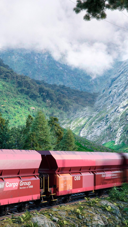 Rendered image of a Rail Cargo Group freight train in a mountain landscape