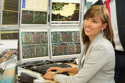 Dispatcher working at a rail control workstation