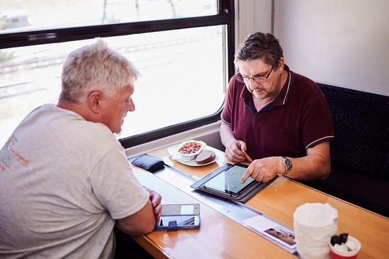 Truck driver in escort vehicle at the table