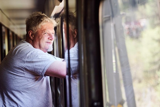 Truck driver looks out of escort vehicle window