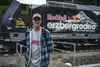 Jonny Walker in front of the Red Bull Erzbergrodeo locomotive, travelling with Rail Cargo Group.