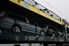 Car transport by rail: vehicles on a double-deck freight wagon.