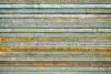 Construction steel – stacked metal beams with traces of rust.
