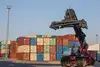 Reach stacker lifting container at BILK Terminal Budapest.