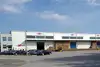 Warehouse Zagreb with exterior view of the building, parked cars, and forklift at the loading area