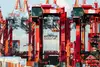 Container terminal with cranes handling containers in freight transport