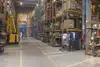 Warehouse in Bosnia with pallets, boxes and yellow forklifts.