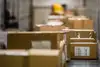 Cartons on conveyor belt symbolising groupage freight transport