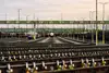 View of a marshalling yard with multiple tracks and parked freight wagons.