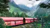 Rendering eines Rail Cargo Group Güterzugs in einer grünen alpinen Berglandschaft