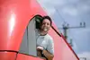 Train driver leaning out of a locomotive cab window