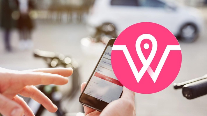 wegfinder App Icon mit Smartphone im Hintergrund