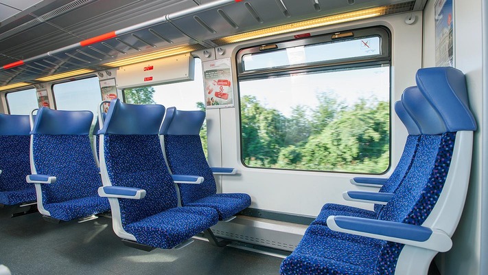 Local train interior view with seating area